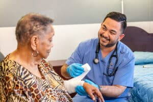 A nurse wrapping the arm of a resident at Beachwood Post-Acute and Rehab